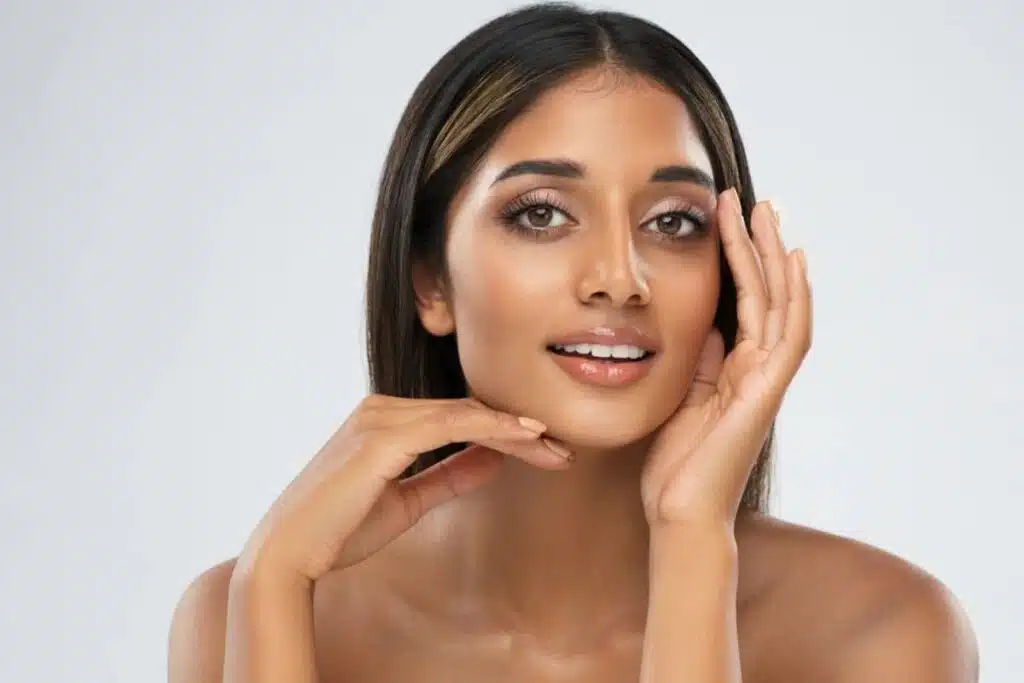 A woman with balanced facial features, showcasing the results of dermal fillers used to enhance facial symmetry.