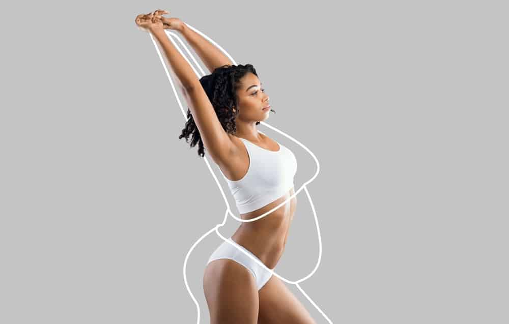 Fit woman stretching in white activewear with contour lines highlighting body sculpting after mommy makeover.